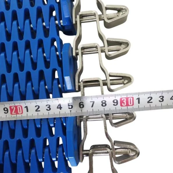 Tape measurement shown across a side-driven belt edge and support surface.