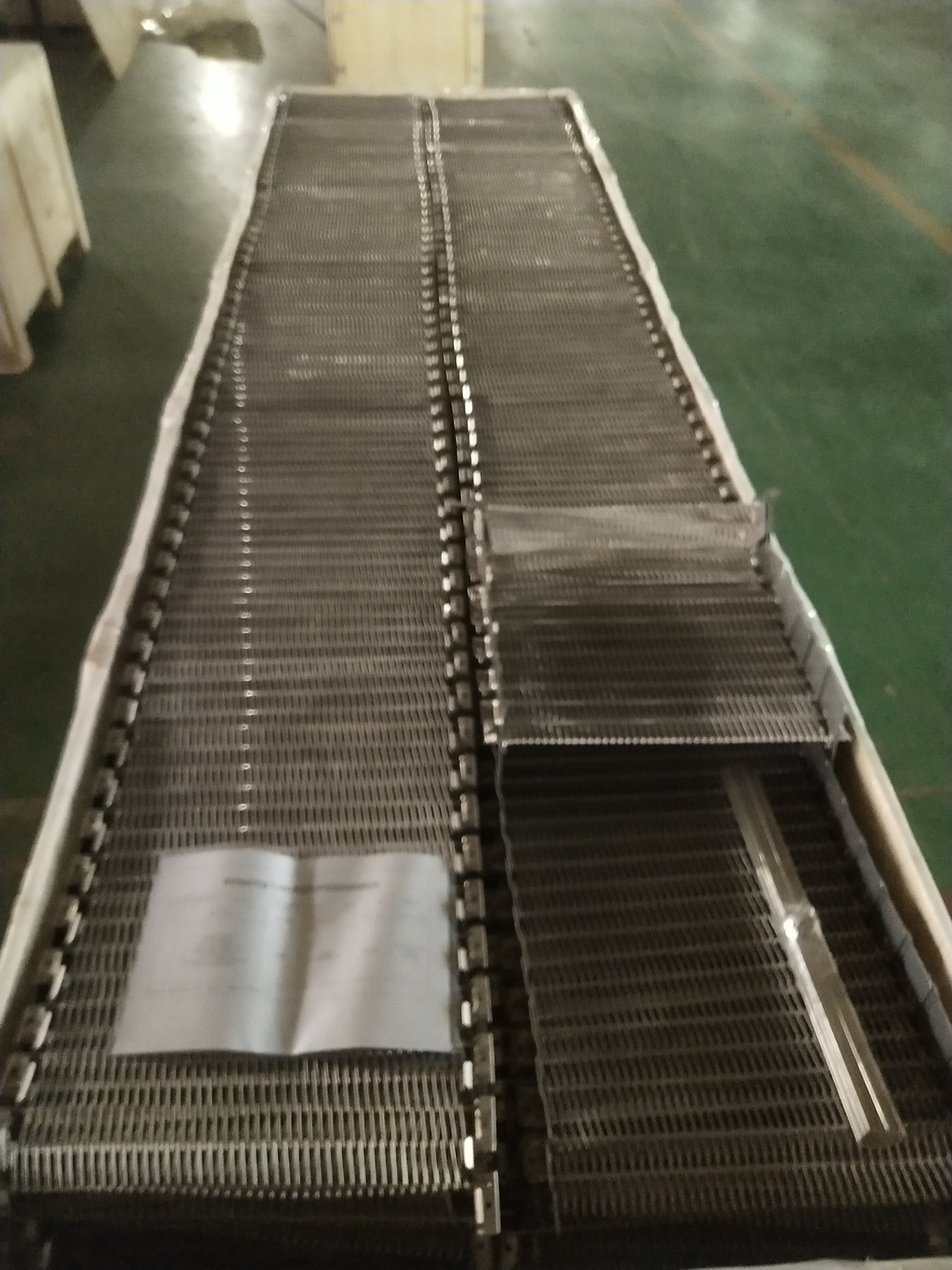 JBL Mesh Belt Export Crate Before Closure from an anonymized Malaysia Self-Stacking Belt replacement project