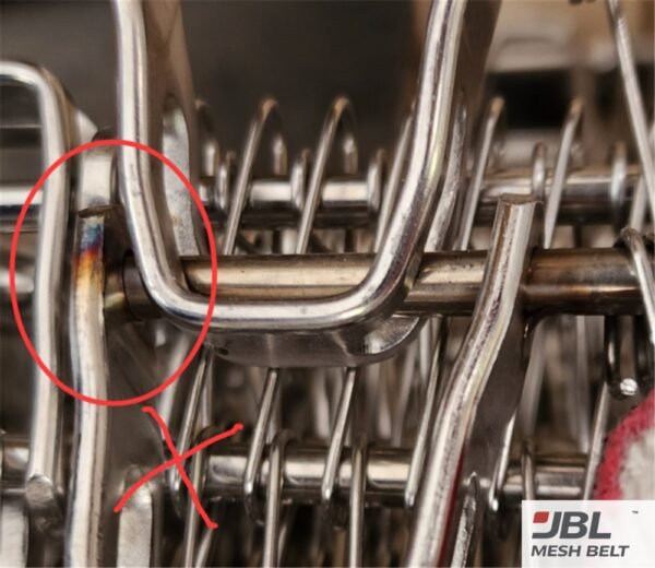 Spiral freezer belt with an arc burn mark at a rod joint, rejected