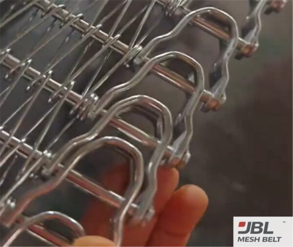 Hand check of rod straightness on a spiral freezer belt sample section