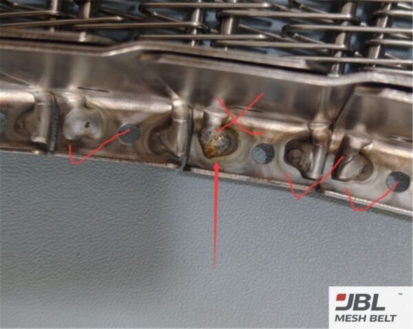 Rejected self-stacking belt side plate with weld defects