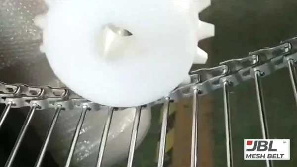 Nylon sprocket running on a new spiral cooling belt to check tooth engagement